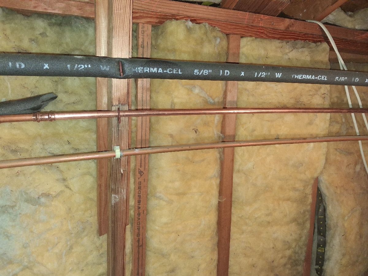 Plumbing replacement work documented during an open-wall repair stage